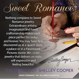 May include: A close-up of a hand drawing on a piece of paper. The text reads "Sweet Romance" and "The Designs of Shelley Cooper".