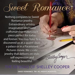 May include: A close-up of a hand drawing on a piece of paper. The text reads "Sweet Romance" and "The Designs of Shelley Cooper".