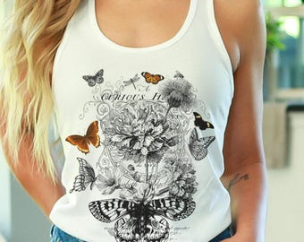 May include: White tank top with a black and white butterfly and floral design. The top features the text "Curious Life" in a script font, along with several butterfly illustrations in various sizes and colors.