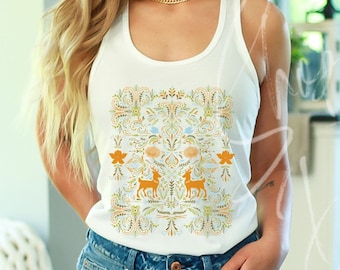 May include: A white tank top with a colorful floral pattern and two deer silhouettes in the center. The pattern features a variety of colors, including green, blue, orange, and white.