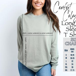 May include: A light green long sleeve Comfort Colors T-shirt. The image includes a size chart with measurements in inches for sizes S to 3XL. The shirt's width is measured from underarm to underarm, and the length from shoulder seam to hem.