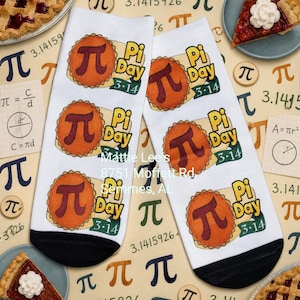 May include: White socks with a black heel and toe feature a repeating design of a pie with the pi symbol and the words "Pi Day 3.14". The background includes pie slices, the pi symbol, and mathematical equations.