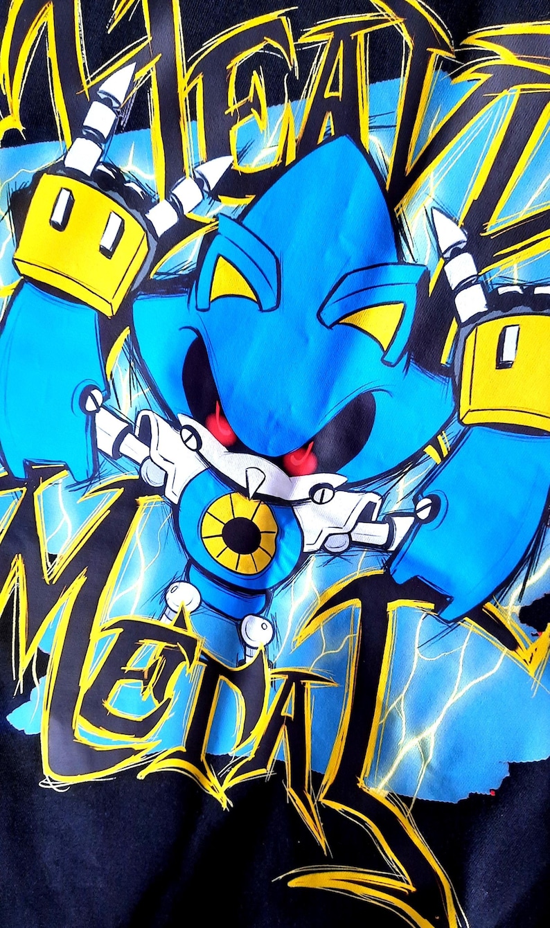 May include: Blue and yellow graphic of a robot character with the word "METAL" in yellow, outlined in black. The robot has red eyes and white and silver accents. Lightning bolts are in the background.