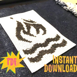 May include: A black and white cross stitch pattern of a stylized flame with waves below it. The pattern is on white Aida cloth and is framed by a black border. The text "INSTANT DOWNLOAD" is printed below the pattern in yellow letters.