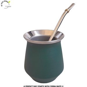 May include: A green yerba mate gourd with a stainless steel rim and a metal straw. The text "A PERFECT DAY STARTS WITH YERBA MATE" is at the bottom. The gourd is designed for drinking yerba mate.