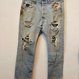 Vintage Levi 501 xx light wash fraying naturally button fly large back leather patch soft not stiff bleach paint mens women’s 33 inch waist