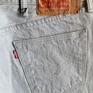 Vintage 501xx Levis Jeans 36 inch waist mens grey light wash Button fly cotton straight classic large leather patch red tab marked 38 x 32