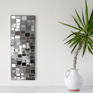 Stainless steel wall sculpture forming a mosaic model C