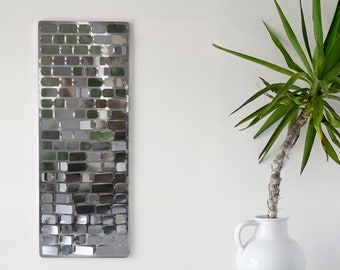 Stainless steel wall sculpture forming a mosaic model B