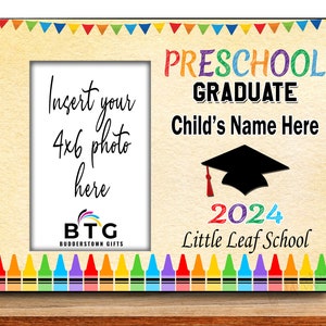 May include: A wooden photo frame with a cream-colored background. The frame has a space for a 4x6 photo and is decorated with colorful crayons and pennants. Text includes "Preschool Graduate," "Child's Name Here," and "2024 Little Leaf School."