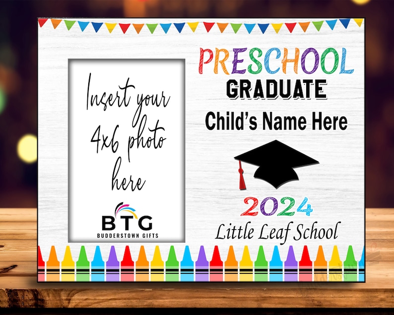 May include: White wooden preschool graduation photo frame with colorful text and crayon border. Features space for a 4x6 photo and text that reads "Preschool Graduate" and "Child's Name Here". Includes a graduation cap graphic and the year 2024.