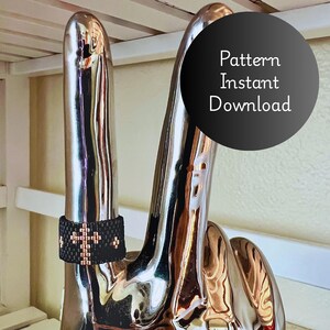 May include: A black beaded ring with a copper-colored cross design is displayed on a silver sculpture of a hand. The image includes a black circle with the text "Pattern Instant Download".