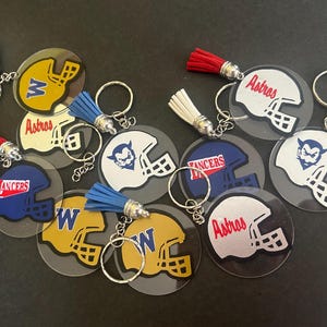 Team Spirit Football helmet keychains - 2 inch resin sealed acrylic keychains with tassel.