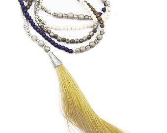 Long beige and purple pompom necklace