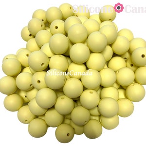 12mm Pastel Yellow Round Silicone Beads. Loose, highest quality, BPA free silicone craft supplies Canada USA Europe. Wholesale Bulk Discount