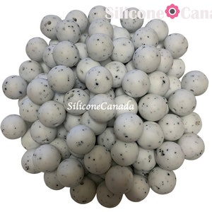 15mm Cookie and Cream Speckled White Round Silicone Beads. Loose, highest quality, BPA free silicone craft supplies Canada USA Europe. Bulk.