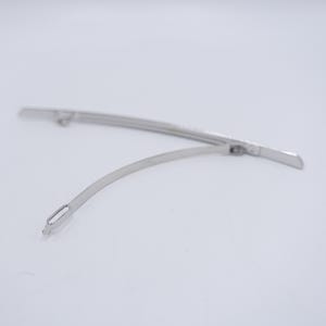 May include: A silver-toned metal hair barrette featuring a long, slightly curved base bar and a thinner, flexible hinged clasp arm that extends from one side. The mechanism includes a small loop at the end of the clasp for securing the hair accessory.