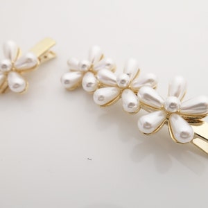 a set of flower petal pearl hair clips