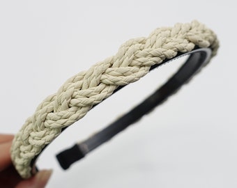 May include: A white braided rope headband with a black elastic band.