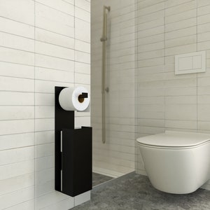 Almacenamiento minimalista de papel higiénico montado en la pared con soporte magnético para papel higiénico.