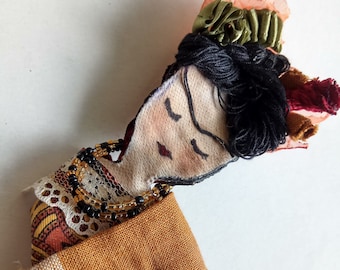 frida kahlo handpainted brooch made from orange peels, dried and coloured with acrylics by mademeathens perfect gift for any occassion