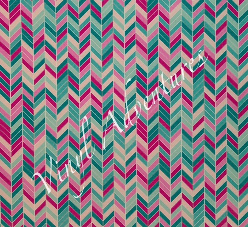 May include: A seamless pattern of teal, pink, and beige chevron shapes. The pattern is repeated throughout the image.