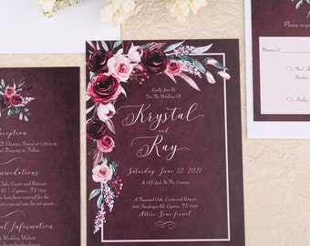 May include: Burgundy wedding invitation suite with floral design. The invitation features the names "Krystal and Ray" and the date "Saturday, June 12, 2021". The RSVP card has a floral design and a place to fill in the guest's name and RSVP choice.