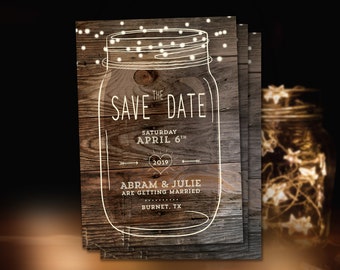 May include: A rustic save the date card with a mason jar design. The jar is outlined in white and has string lights inside. The text reads "The Save the Date, Saturday April 6th, 2019, Abram & Julie are getting married, Burnet, TX."