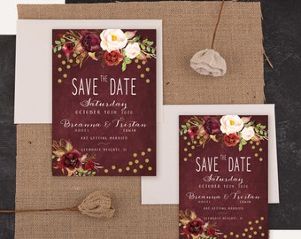 May include: Save the date card with burgundy background and gold confetti. The card features a floral design with red, white, and pink flowers. The text reads "Save the Date" with the date "Saturday, October 10th, 2020". The names "Breanna & Tristan" are printed below the date.