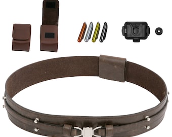 May include: A brown leather belt with a silver buckle and a brown leather holster attached to the side. The belt has a double layer of leather and is secured with a metal buckle. The holster is designed to hold a small object, such as a knife or a tool.