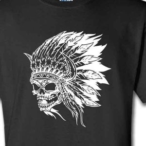 May include: Black t-shirt with a white graphic of a skull wearing a Native American headdress.