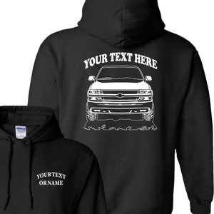 May include: Black hooded sweatshirt with a white outline of a Chevrolet Suburban SUV on the back. The text "YOUR TEXT HERE" is above the SUV. The front of the sweatshirt has the text "YOUR TEXT OR NAME" in white.