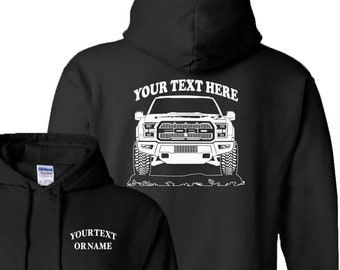 May include: Black hooded sweatshirt with a white outline of a Ford F-150 pickup truck on the back. The text "YOUR TEXT HERE" is above the truck. The front of the sweatshirt has the text "YOURTEXT ORNAME" in white.