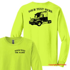 May include: Neon yellow long-sleeve shirt with a black graphic of a semi-truck on the back and the text "YOUR TEXT HERE". The front of the shirt has the text "YOUR TEXT OR NAME". Copyright DGF Grafix.
