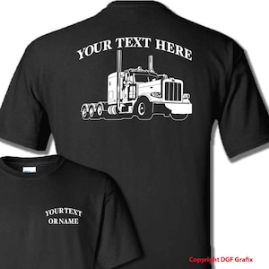 May include: Black t-shirt with a white graphic of a semi-truck on the back, and the text "YOUR TEXT HERE" above the truck. A smaller t-shirt in the foreground has the text "YOUR TEXT OR NAME".