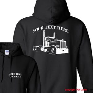 May include: Black hooded sweatshirt with a white graphic of a semi-truck on the back. The text "YOUR TEXT HERE" is arched above the truck. The front of the sweatshirt has the text "YOUR TEXT OR NAME".