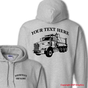 May include: Gray hooded sweatshirt with a black and white illustration of a dump truck on the back. The text "YOUR TEXT HERE" is above the truck. The front of the sweatshirt has the text "YOUR TEXT OR NAME" in black.