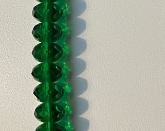 Emerald green glass faceted round bead 7.5mm