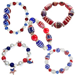 May include: Five patriotic bracelets with red, white, and blue beads. Some bracelets feature star-spangled beads, while others have striped or solid beads. One bracelet has a star charm with the American flag.