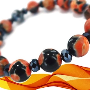 May include: A bracelet made with black and orange agate beads and black crystal beads.