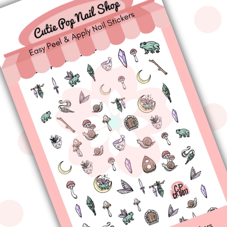 This image showcases Cutie Pop Nail Shop’s Cottage Core nail decals against a white background with a Cutie Pop Nail Shop logo and watermark. These back-to-nature-style nail decals designs include mushrooms, toadstools, frogs, frogs with wings, lilac