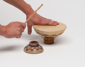 hand-closed drum with leather wand