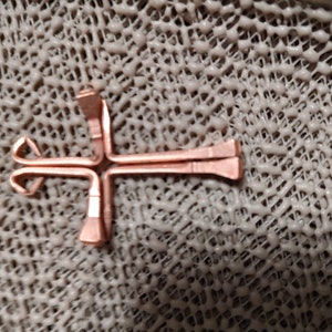 Four steel horse shoe nails electroplated with real copper and precision bent