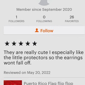 May include: Red, white, and blue Puerto Rican flag earrings with gold-colored metal hoops. The earrings have a flip-flop design. The earrings are on a white background.