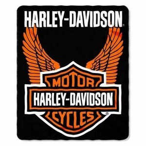 May include: Black blanket featuring the Harley-Davidson logo. The logo includes the words "HARLEY-DAVIDSON" in white, with orange wings and a shield design that reads "MOTOR HARLEY-DAVIDSON CYCLES."