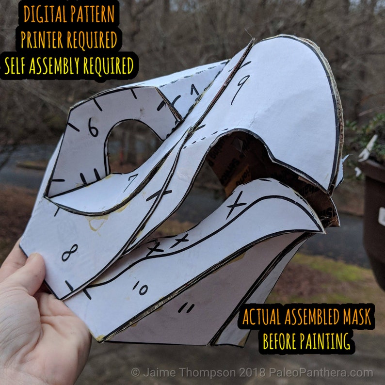 May include: A white paper mask pattern with numbered pieces, ready to be assembled. The text "DIGITAL PATTERN", "PRINTER REQUIRED", "SELF ASSEMBLY REQUIRED", "ACTUAL ASSEMBLED MASK", and "BEFORE PAINTING" is printed on the paper.