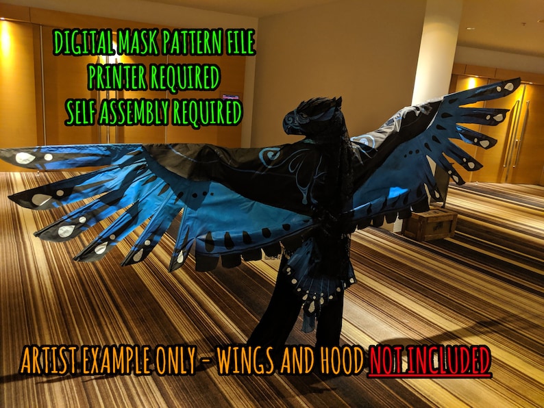 May include: A digital mask pattern file for a blue and black winged creature. The image shows an example of the finished mask, with the text "DIGITAL MASK PATTERN FILE", "PRINTER REQUIRED", and "SELF ASSEMBLY REQUIRED" at the top. The text "ARTIST EXAMPLE ONLY - WINGS AND HOOD NOT INCLUDED" is at the bottom of the image.