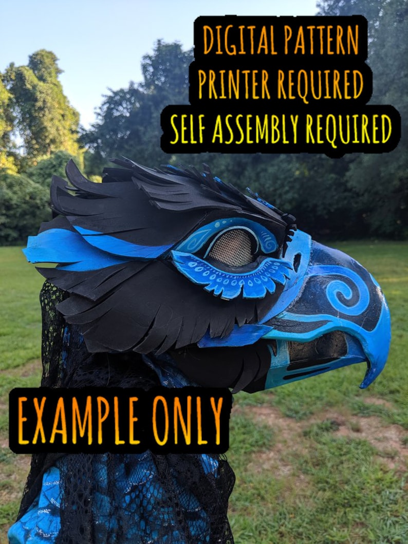 May include: A blue and black 3D printed bird mask with a mesh eye opening. The mask is partially assembled and has a feathered crest. The text "DIGITAL PATTERN PRINTER REQUIRED SELF ASSEMBLY REQUIRED" is displayed above the mask. The text "EXAMPLE ONLY" is displayed below the mask.