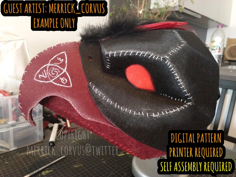 May include: A red and black felt mask with a white symbol on the side. The mask is a digital pattern that requires a printer and self assembly. The text "GUEST ARTIST: MERRICK_CORVUS EXAMPLE ONLY" is at the top of the image. The text "COPYRIGHT MERRICK_CORVUS@TWITTER" is at the bottom of the image. The text "DIGITAL PATTERN PRINTER REQUIRED SELF ASSEMBLY REQUIRED" is at the bottom right of the image.