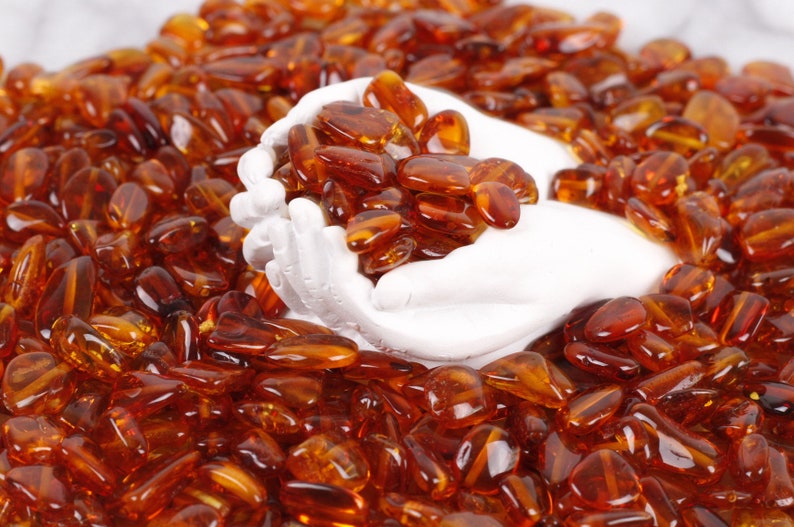 Dark Honey Bean Natural Amber Drilled BeadsCrafters 11mm-7mmApprox 60 amber beads in each 10 grams Baltic Amber Beads with holes